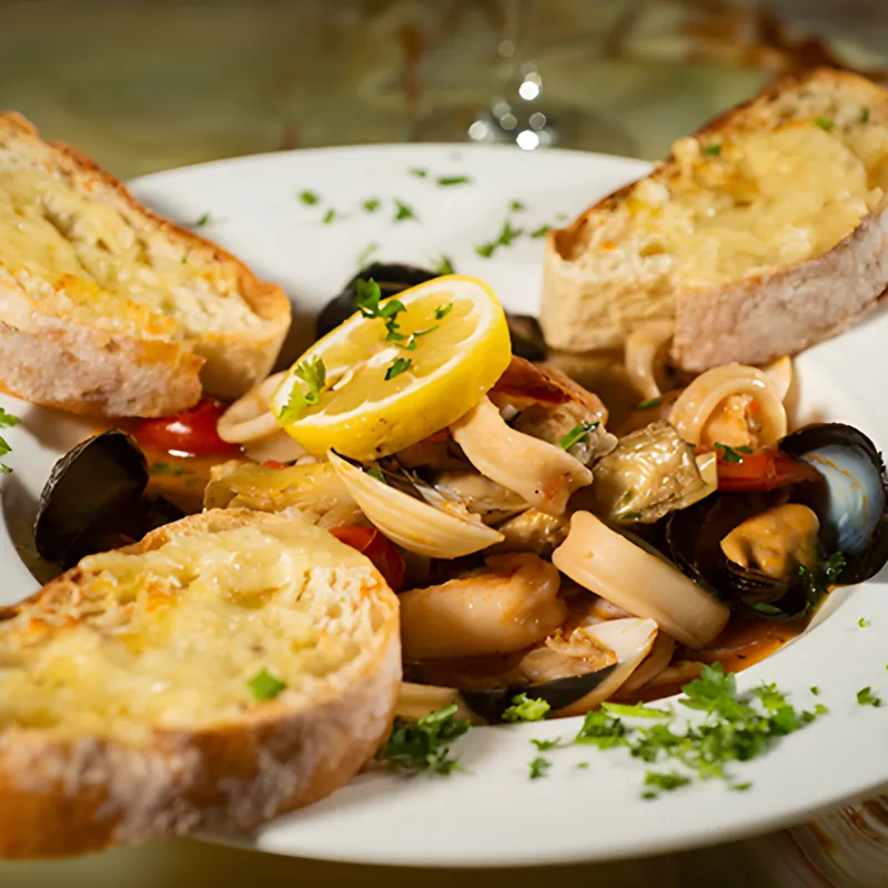 Seafood scampi with mussels, clams, calamari and shrimp between slices of garlic crostini